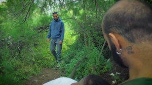 Suit guy proves his strength in nature scene